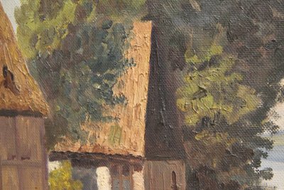 Maleri af ''house by the lake'' i gylden ramme.